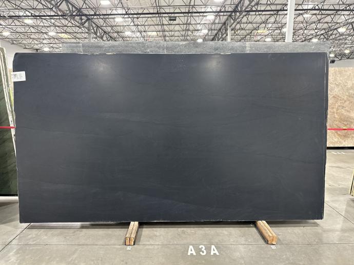 Dark gray stone slab in showroom