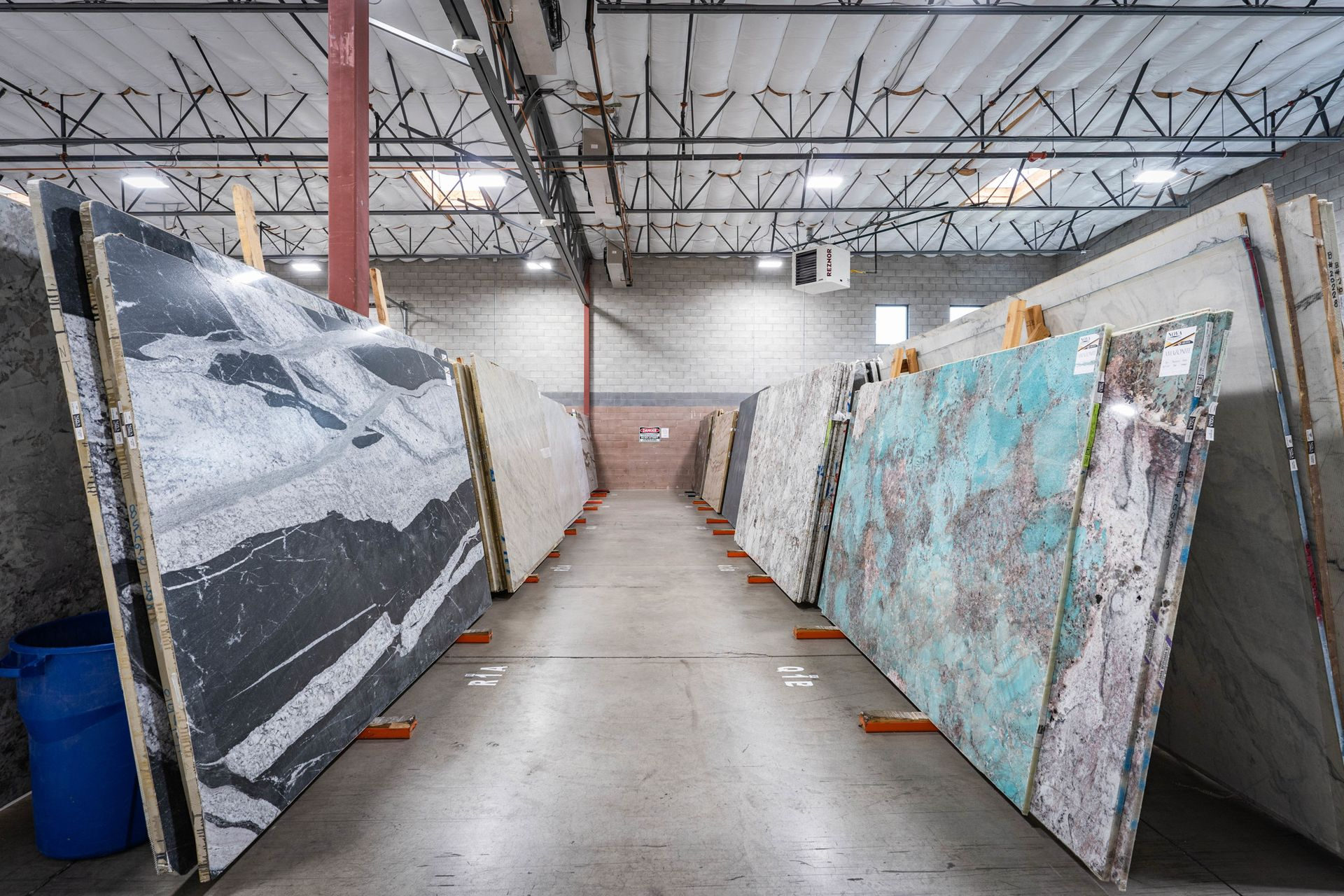 Natural stone slabs with dramatic veining patterns displayed in the Nova Tile and Stone Minden NV showroom