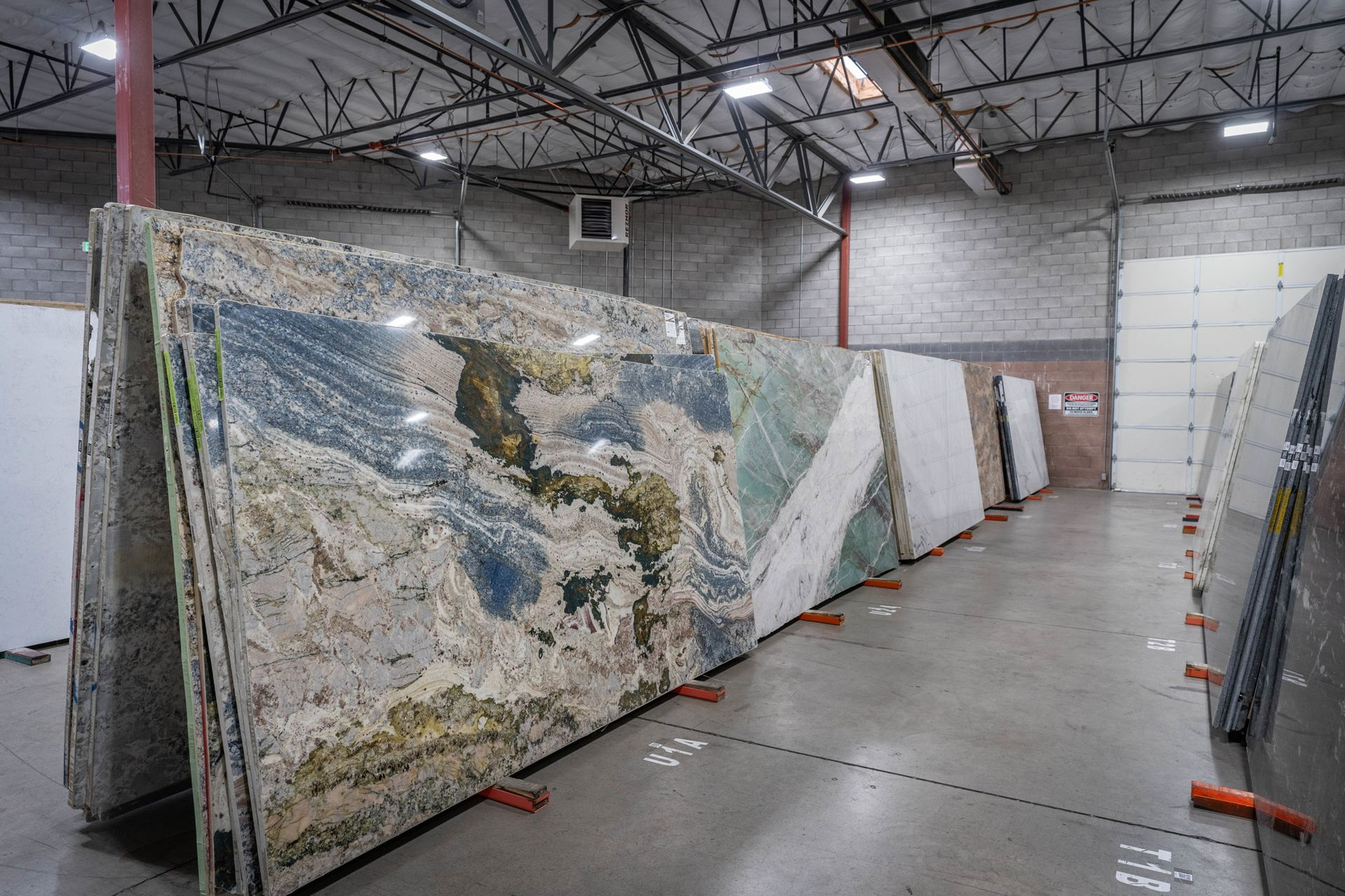 Exotic stone slabs featuring blue and green veining on display at Nova Tile and Stone Minden Nevada showroom