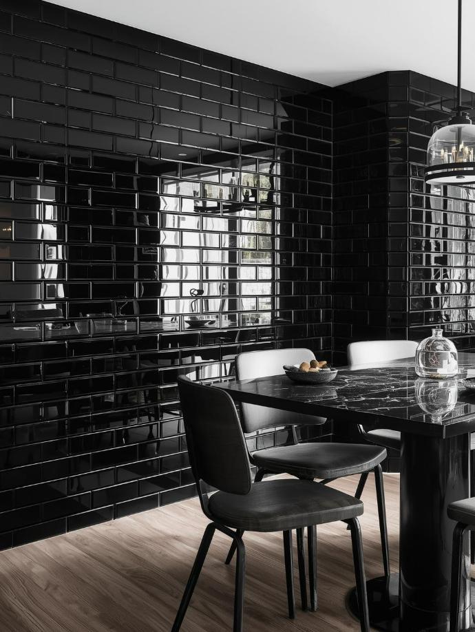 black glass subway tile in dining area