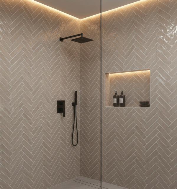 A modern walk-in shower featuring subway tiles in a herringbone pattern
