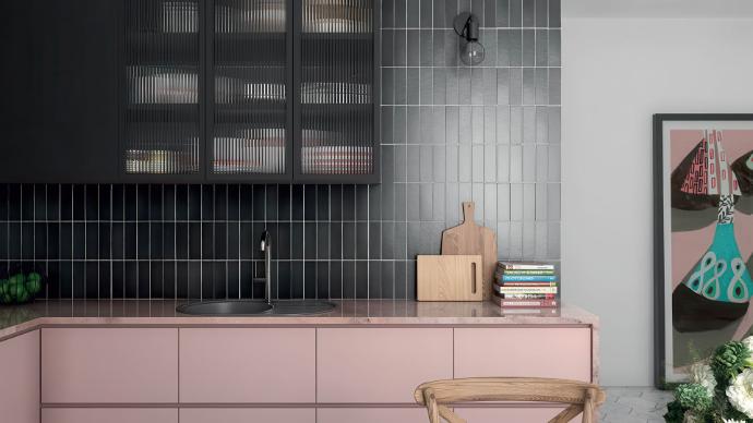 A modern space featuring a vertical black subway tile backsplash