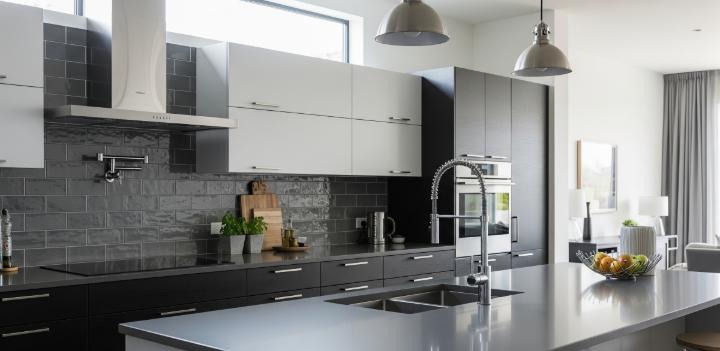 Grey kitchen tiles backsplash reflecting beauty and warmth.