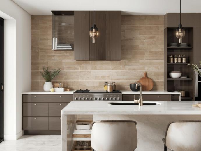 Upscale kitchen with a backsplash of natural-toned travertine subway tiles, dark wood cabinetry, a stainless steel range, and a white marble kitchen island.