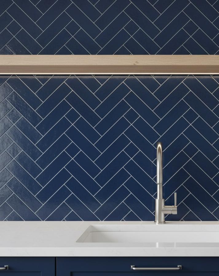 Herringbone pattern subway tile kitchen backsplash with white marble countertop
