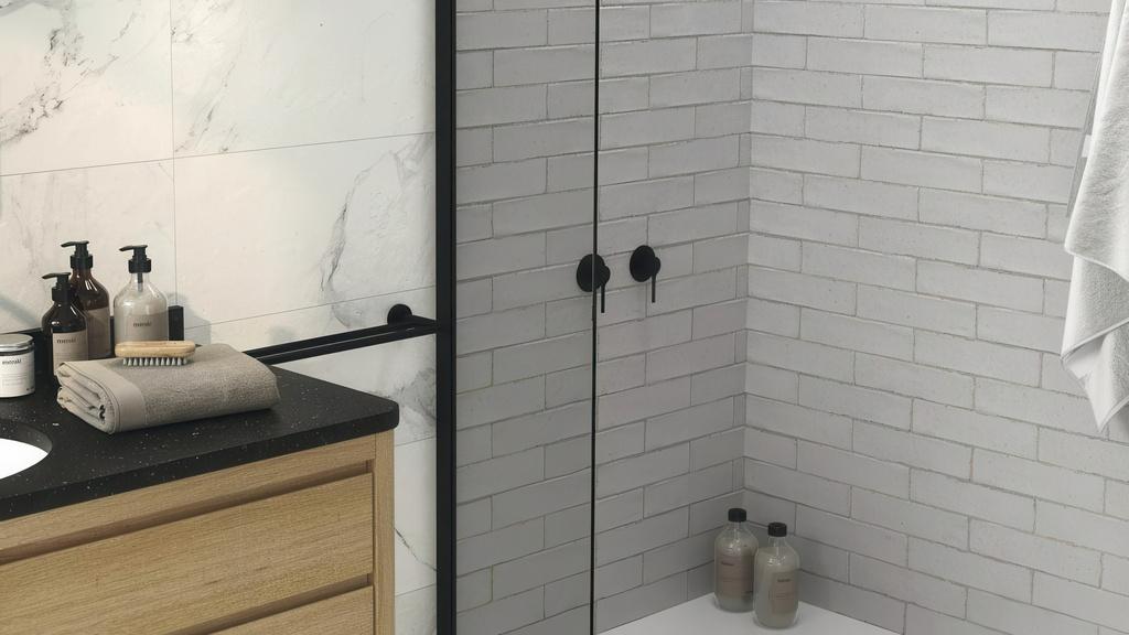 White subway tile shower with black fixtures