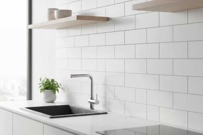 3x12 matte white porcelain subway tile installed in modern kitchen backsplash