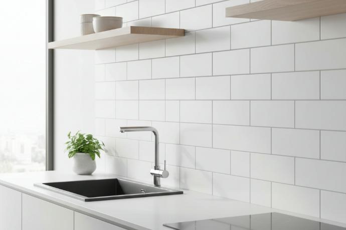 White subway tile kitchen backsplash with modern sink