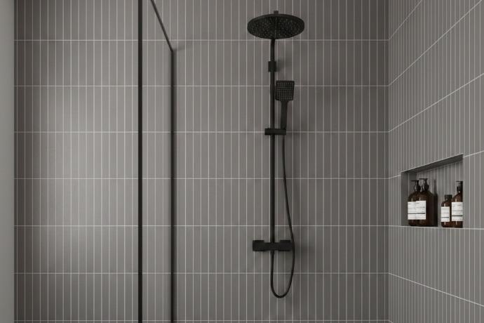 Contemporary bathroom shower wall featuring vertical stack 2x4 ceramic subway tiles in grey