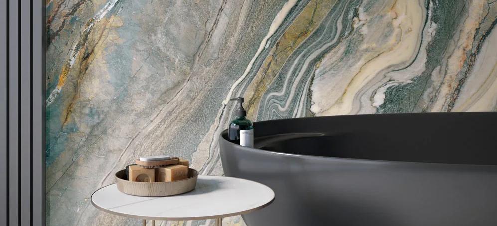 Luxury bathroom featuring Royal Peacock porcelain slabs wall with modern black freestanding tub.