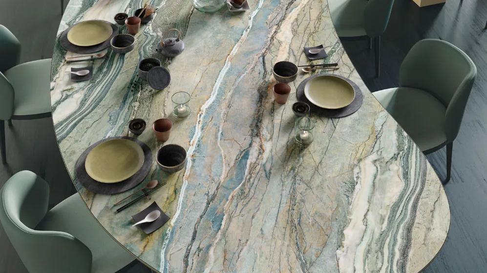 Overhead view of Royal Peacock porcelain slabs table displaying natural stone-inspired veining details.