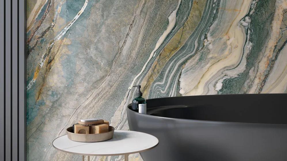 Luxury bathroom design with Royal Peacock porcelain slabs wall and minimalist matte black fixtures.