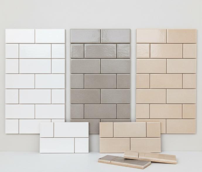 Multiple color options of horizontal 5x10 subway tile samples including white, gray, and beige finishes
