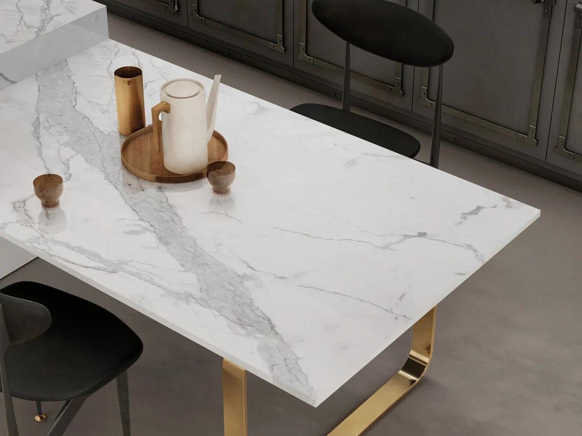 Statuario Principe porcelain slabs dining table with brass base and decorative tray