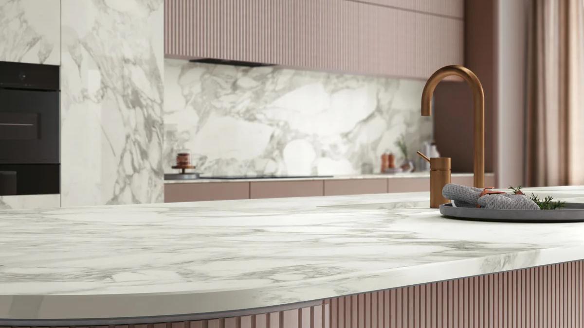 Modern kitchen featuring Calacatta Magnifico Porcelain Slabs countertop with white marble veining pattern.