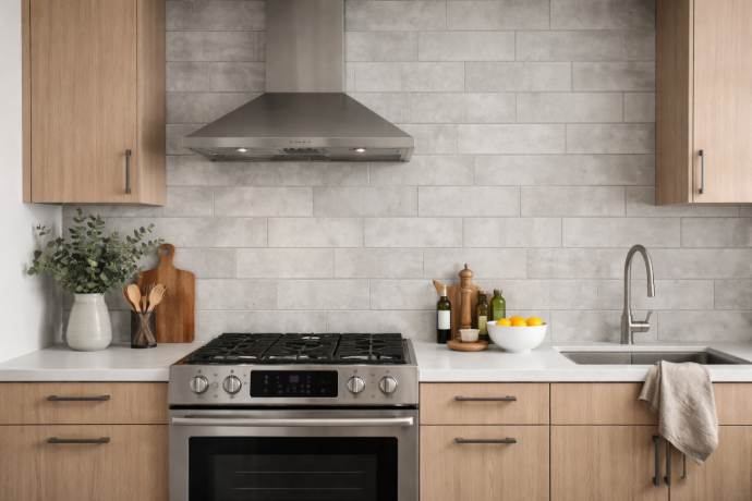 Cement look subway tiles installed in modern kitchen backsplash with matte finish and grey tones