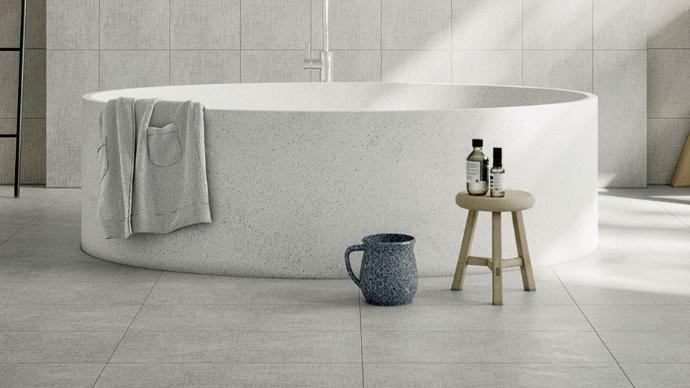 Enchanted 12x24 Matte Fabric Look Porcelain Tile installed in a modern bathroom with a freestanding bathtub and minimalist design