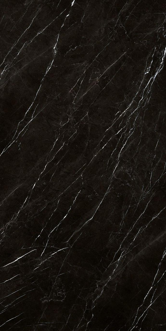 Close up of Nero Marquinia porcelain slabs highlighting elegant white veining on rich black background.