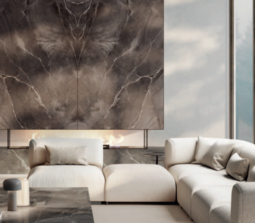 Pulpis Brown Porcelain Slabs installed on accent wall in luxury living space with cream sofa.