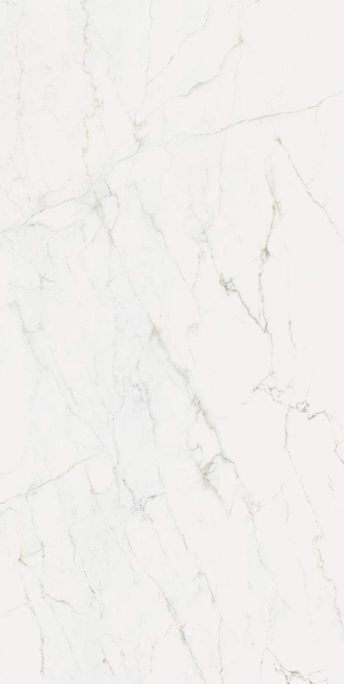 Calacatta Glory porcelain slabs featuring bright white base with soft grey and gold veining.