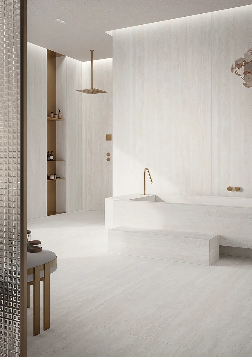 Spa bathroom showcasing Travertino Bianco porcelain slabs with rain shower and built in bathtub design.