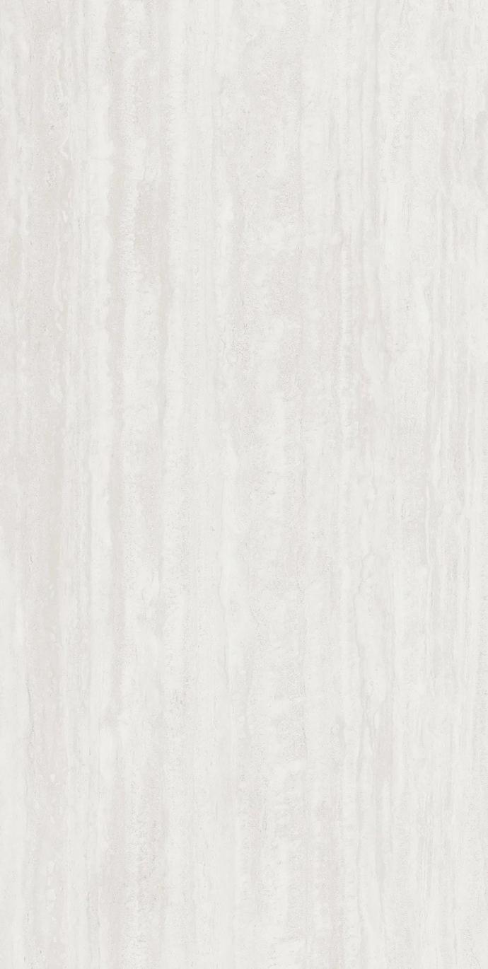 Close up of Travertino Bianco porcelain slabs showing creamy white tones and delicate natural texture.