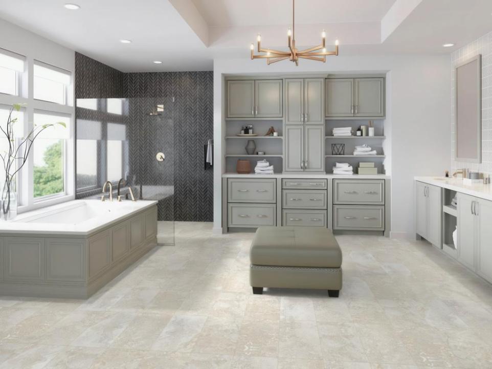 Modern primary bathroom with Travertine Look Subway Tiles For Showers on the floor, paired with a dark herringbone accent shower wall.