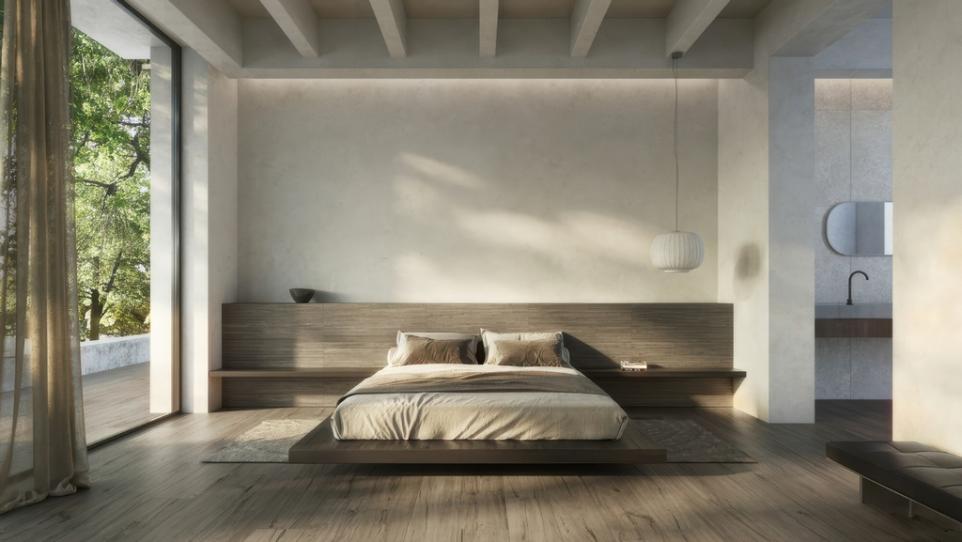Bedroom featuring a built-in taupe color wood look subway tile for accent wall behind a low-profile platform bed.