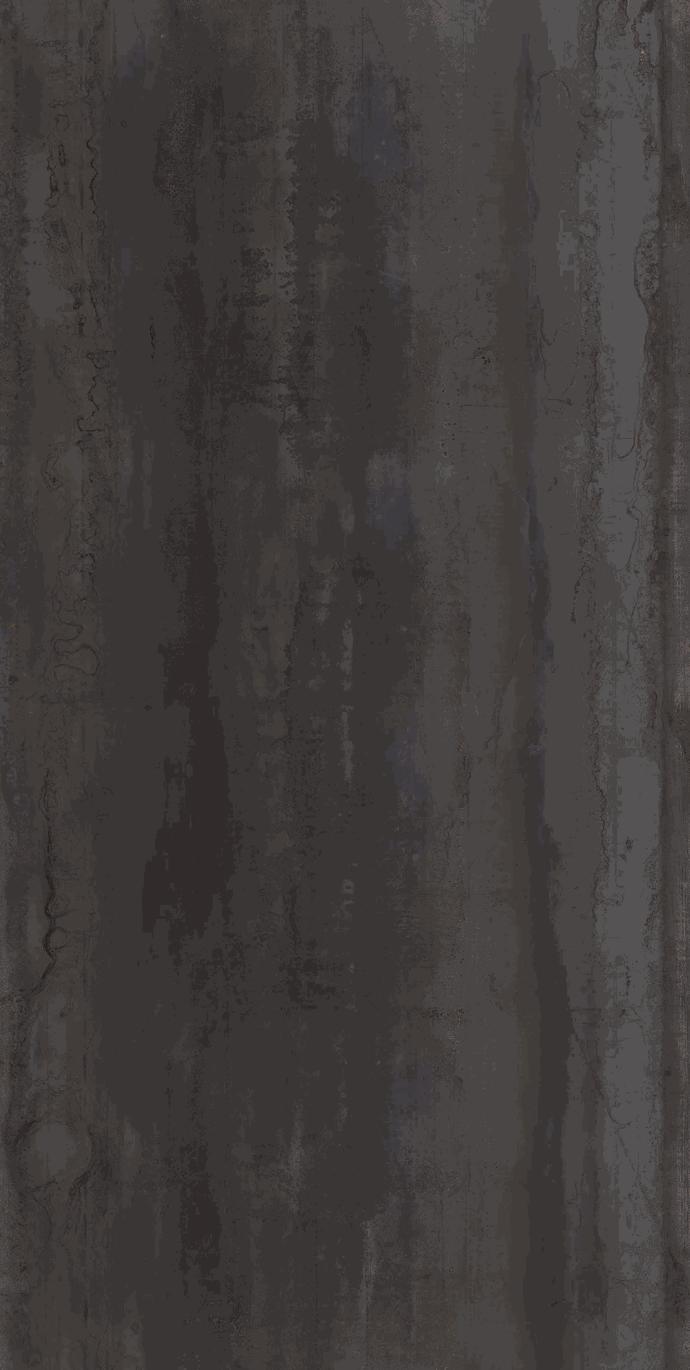 Close-up of Metal Dark porcelain slabs displaying dark gray oxidized metal appearance and patina.