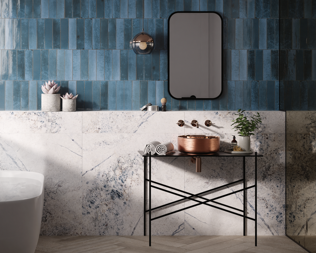 Modern space featuring blue zellige look subway tiles for bathroom with marble accents and copper fixtures.