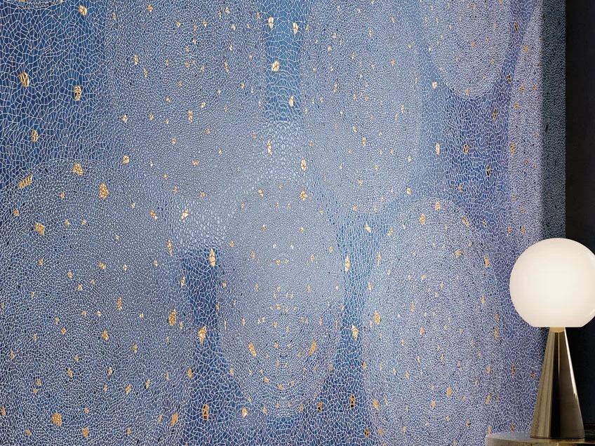 Holos Aegean Blue Porcelain Slabs wall with gold metallic accents and stardust finish detail.
