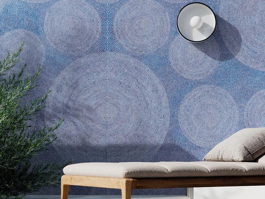 Holos Aegean Blue Porcelain Slabs used as decorative patio wall with modern outdoor furniture.