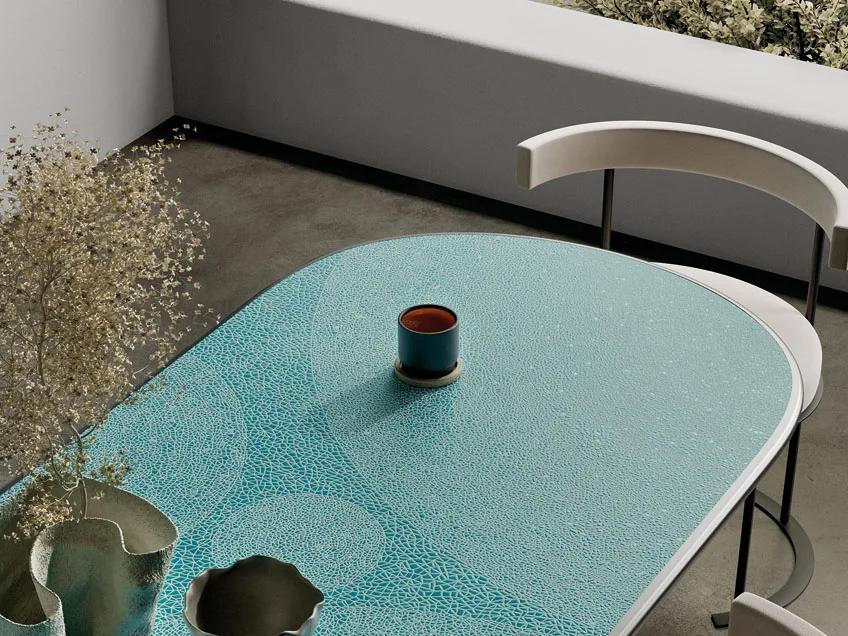 Close-up view of Holos Andaman Emerald Porcelain Slabs with organic green mosaic pattern.