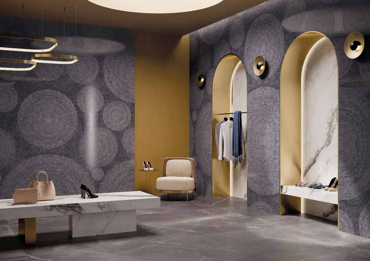 Holos Vik Black porcelain slabs featuring metallic gold details in upscale modern living room.