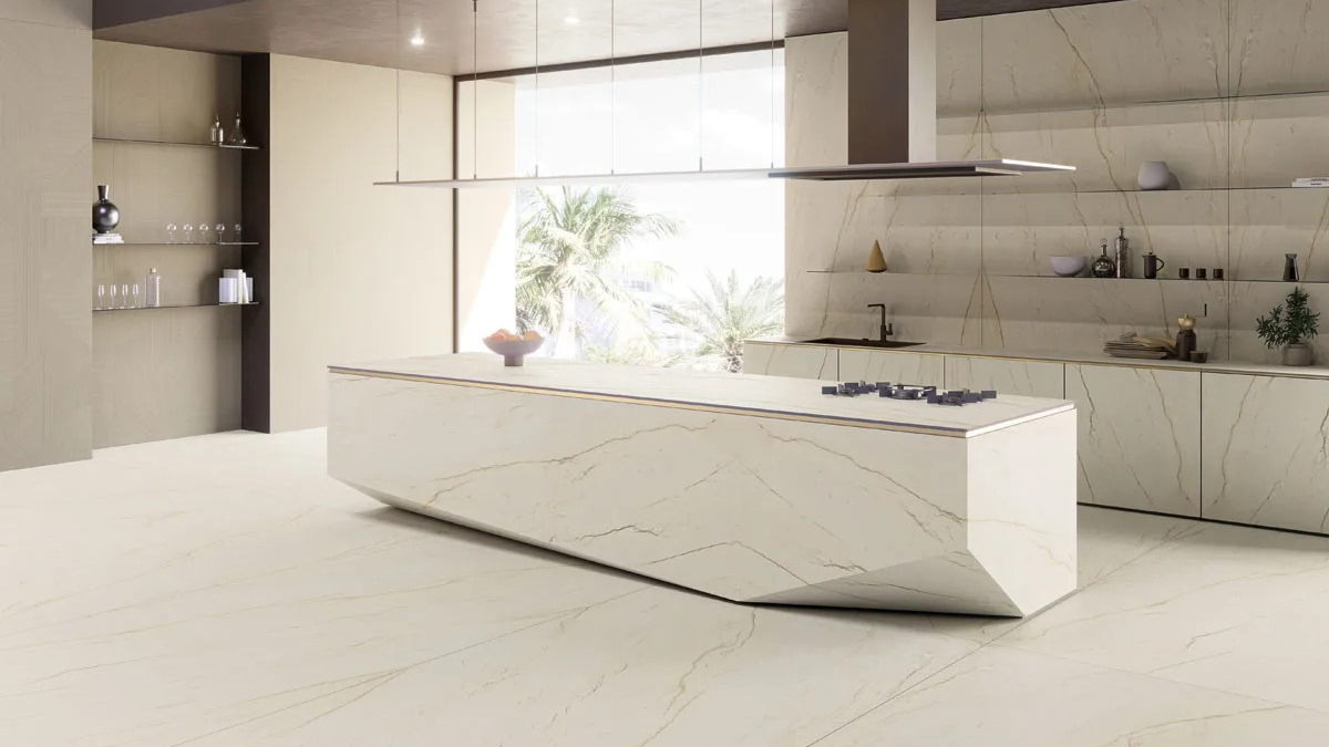 Contemporary kitchen featuring curved Calacatta Brasile porcelain slabs island with seamless veining.