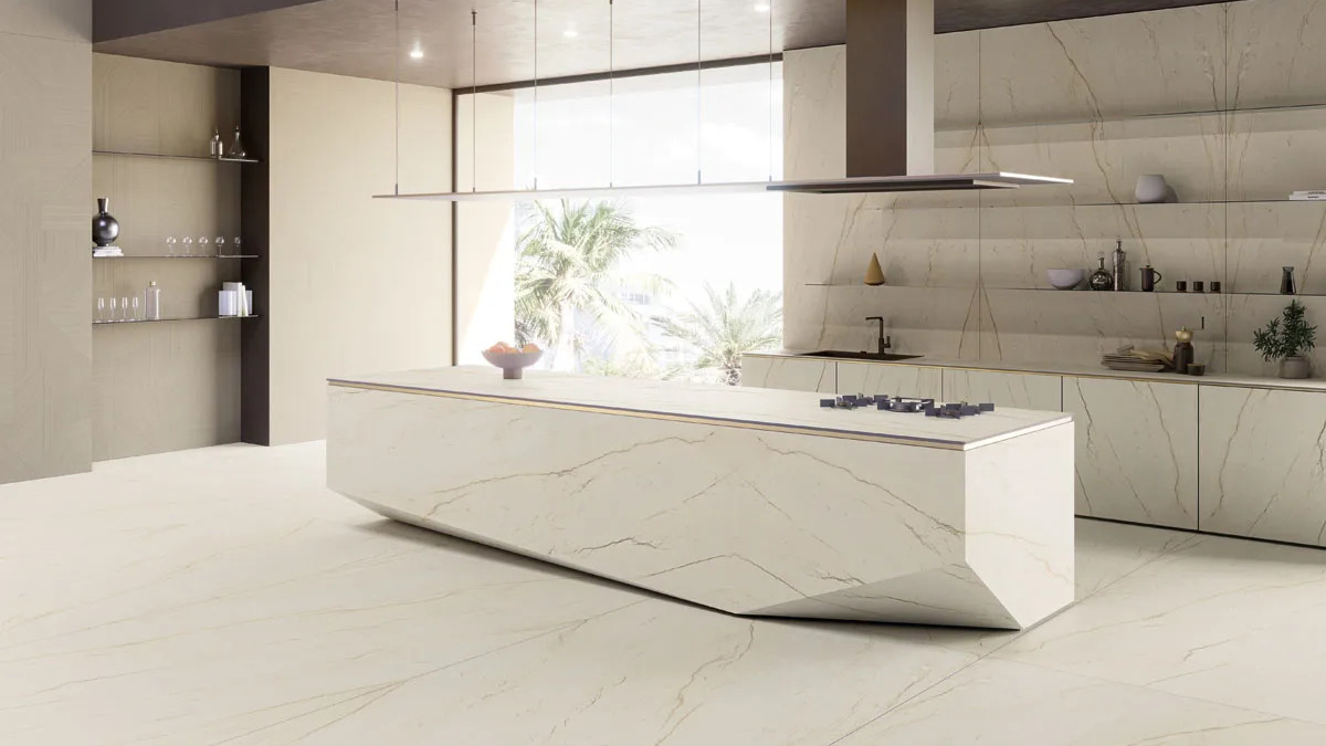Sculptural kitchen island crafted from Calacatta Brasile porcelain slabs with unique angular design.