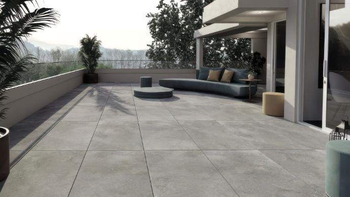 Exterior patio flooring featuring Aldridge Limestone Look Porcelain Tile in Obsidian finish