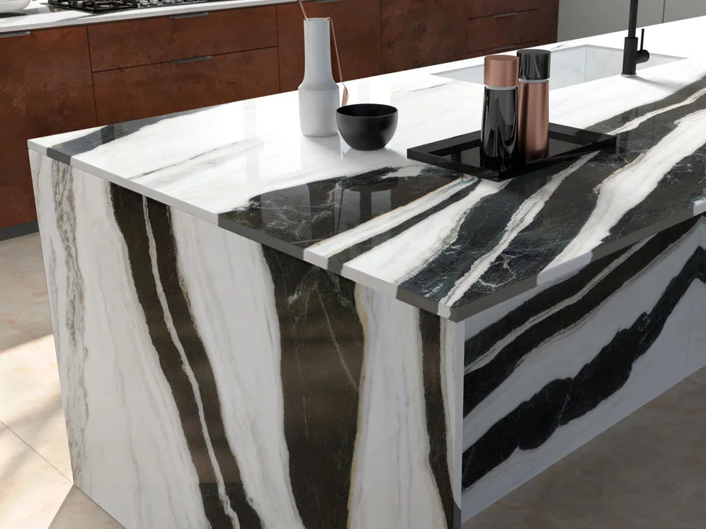 White porcelain slabs kitchen island with waterfall edges and black veining details.