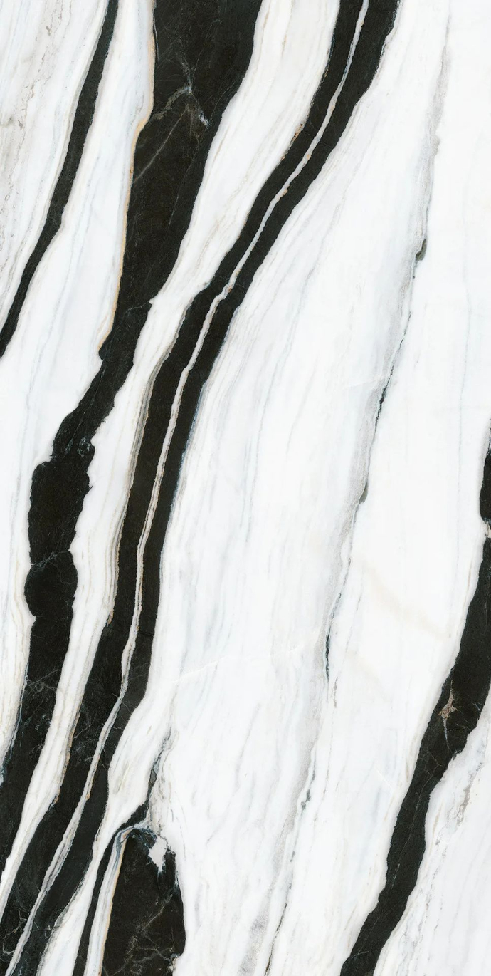 Panda White porcelain slabs detail with dramatic diagonal black and white veining pattern.