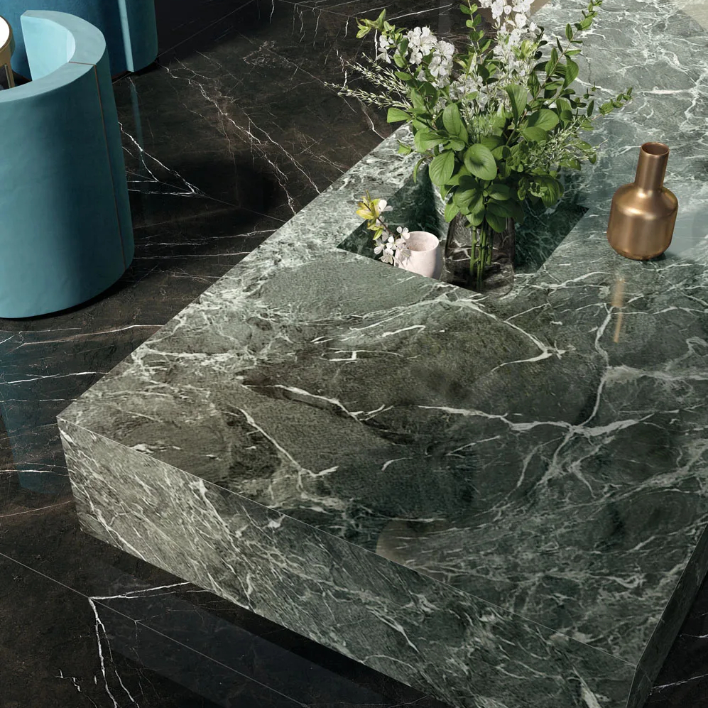 Close-up of Verde France Porcelain Slabs counter showing rich green marble pattern detail.