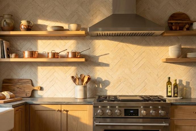 Ivory influence porcelain tile with authentic concrete appearance installed as kitchen backsplash with herringbone pattern