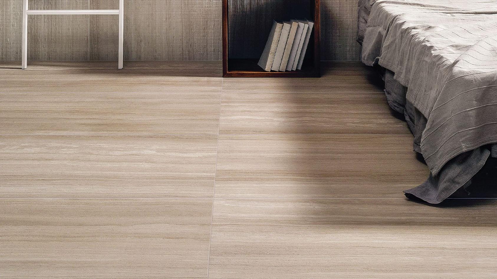 Modern interior hallway featuring Torrent in Crema porcelain tile on floors and walls.