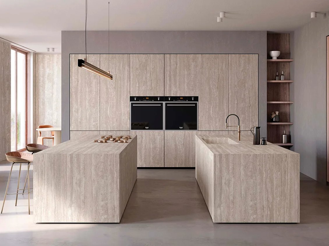 Travertino Chiaro porcelain slabs covering full kitchen including dual islands and tall cabinet wall panels.