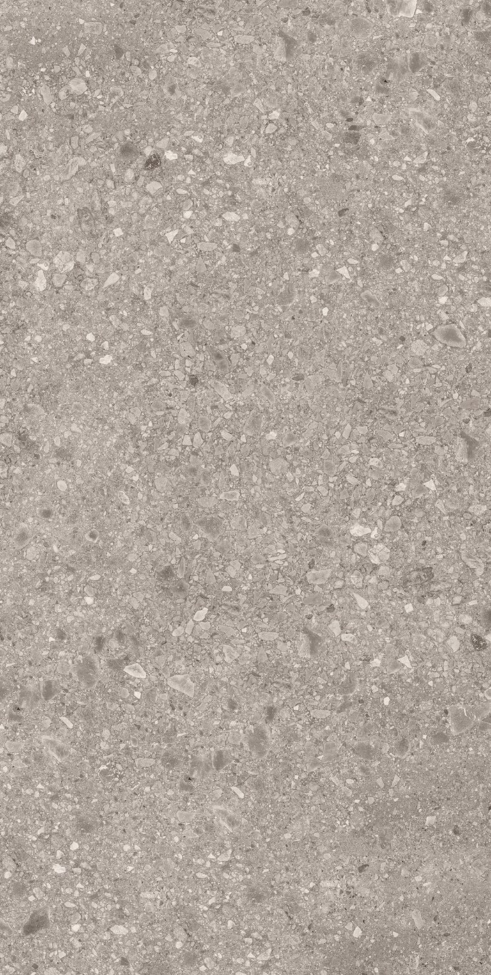 Close-up of Milan Stone porcelain slabs displaying authentic terrazzo-style stone pattern texture.