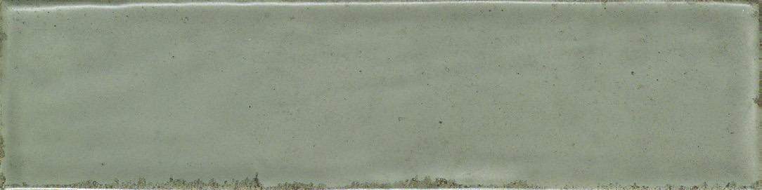 Detail of a Nantes Noce subway tile featuring a deep earthy tone and unique surface undulations