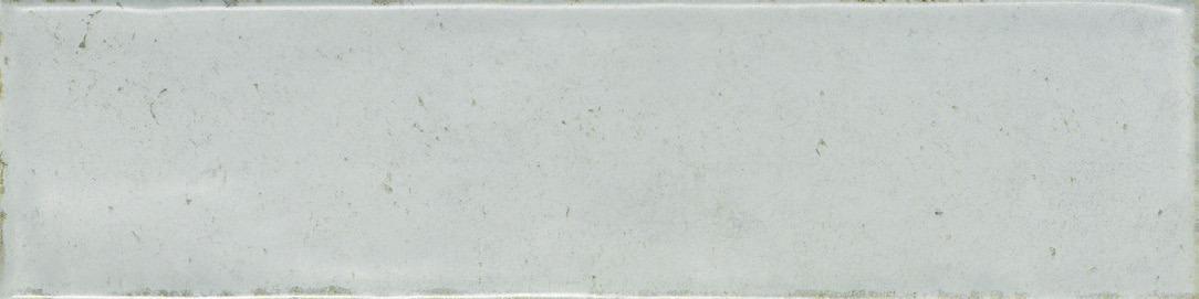 Close-up of a Nantes Grigio tile showing its cool grey tone and handcrafted, textured surface.
