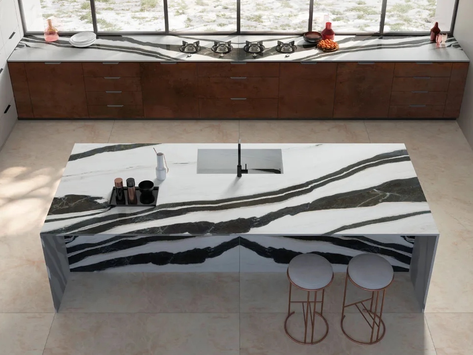 Contemporary kitchen island showcasing Metal Corten porcelain slabs with bold dark veining and bar stools