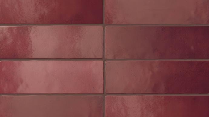 Perfection 2.5x8 matte porcelain tile in rosso color in bold brown grout