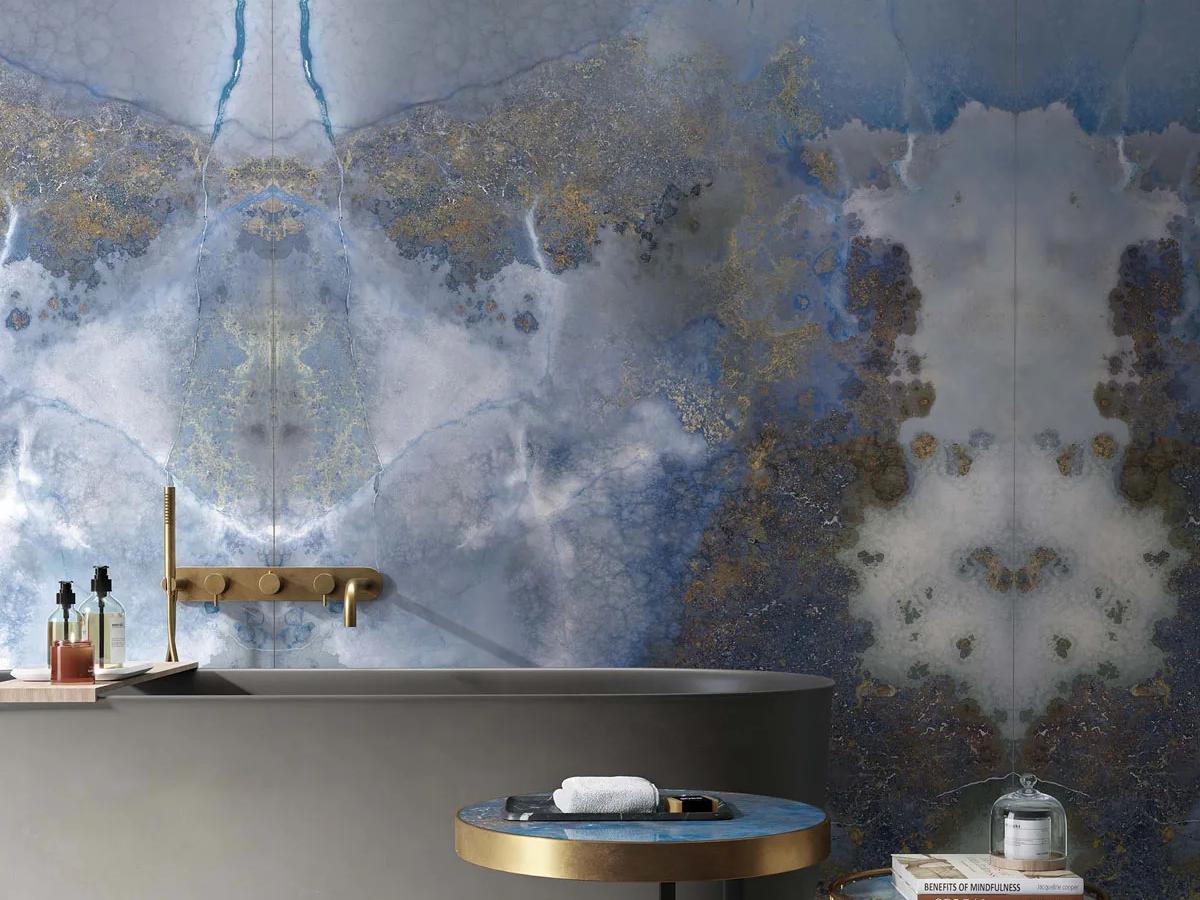 Feature wall using Thunderstorm porcelain slabs displaying bold blue and bronze veining patterns.