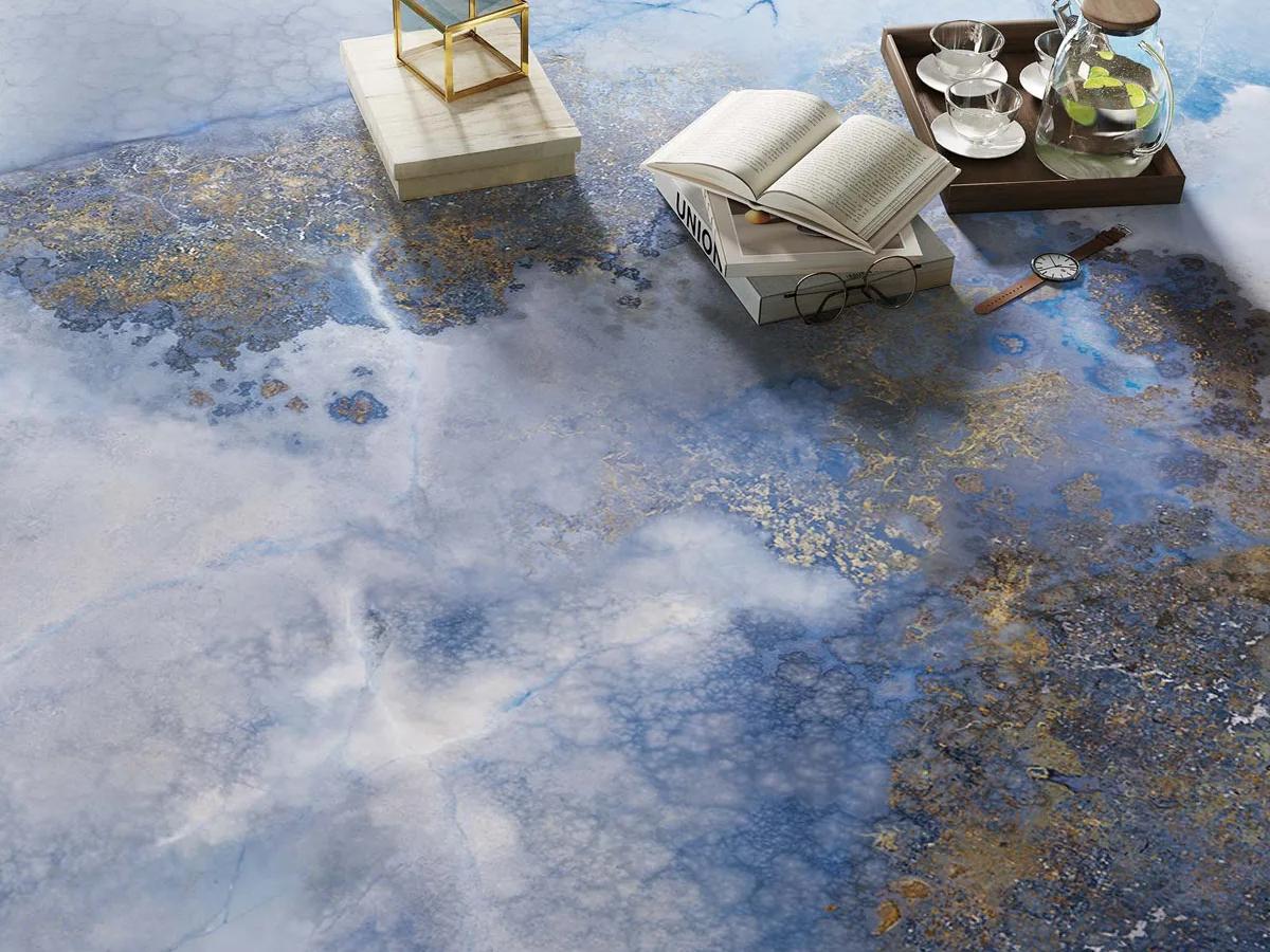 Outdoor flooring application of Thunderstorm porcelain slabs with dramatic blue and bronze patterns.